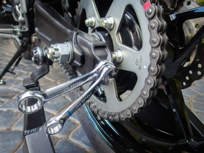 Adjusting motorcycle chain